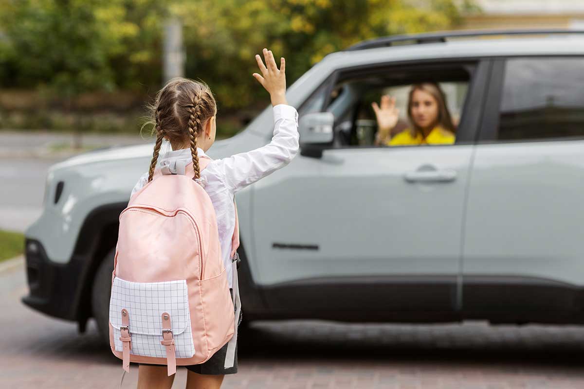 back-view-girl-waving-mother