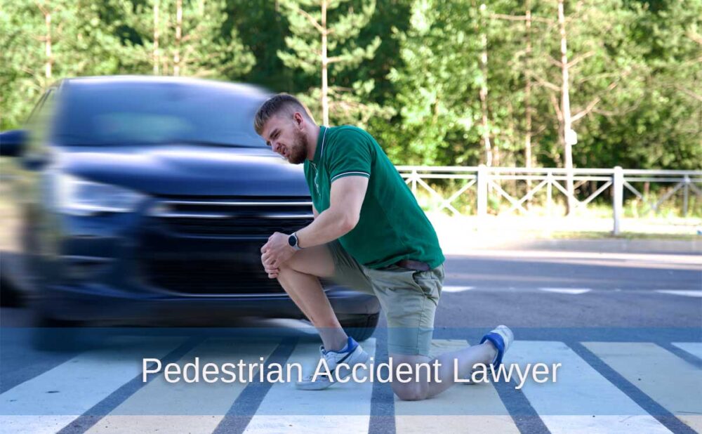 A man kneels on the road after being hit with a car, emphasizing the importance of legal support for pedestrian accidents.