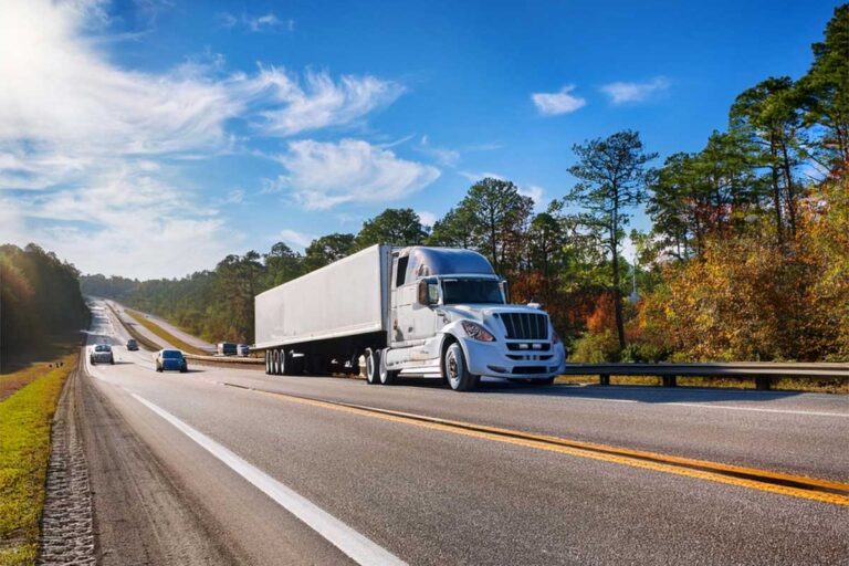 A semi truck on the road, emphasizing the key differences in accident dynamics between trucks and other vehicles.