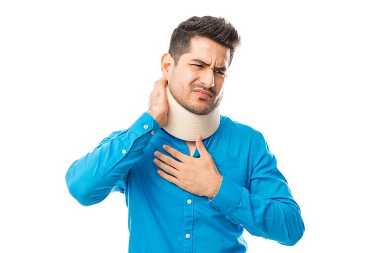 A man wearing a neck brace holds his neck, representing typical car accident injuries.