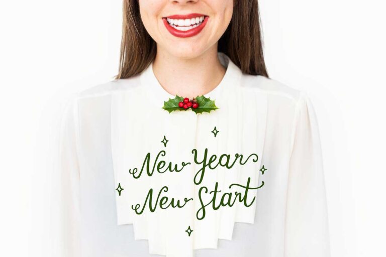 A woman proudly wears a "New Year, New You" shirt, symbolizing a fresh start after overcoming personal injury.