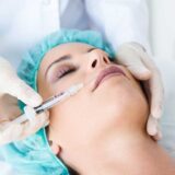 Close up showing a woman receiving a Botox facial treatment, highlighting the importance of safety in cosmetic procedures.