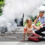A man on a phone helps an injured woman after a crash, highlighting the need to call 911 immediately after a car accident in Georgia.