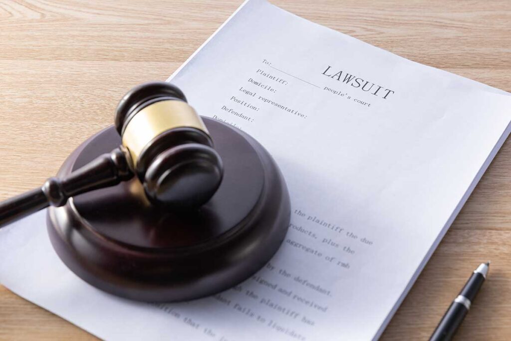 A gavel rests on legal documents, symbolizing the dangers of tort reform for injury victims in Georgia.