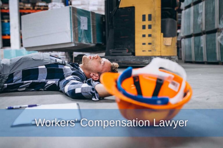 A man lies injured on a warehouse floor, illustrating the importance of hiring a Georgia workers' compensation lawyer.