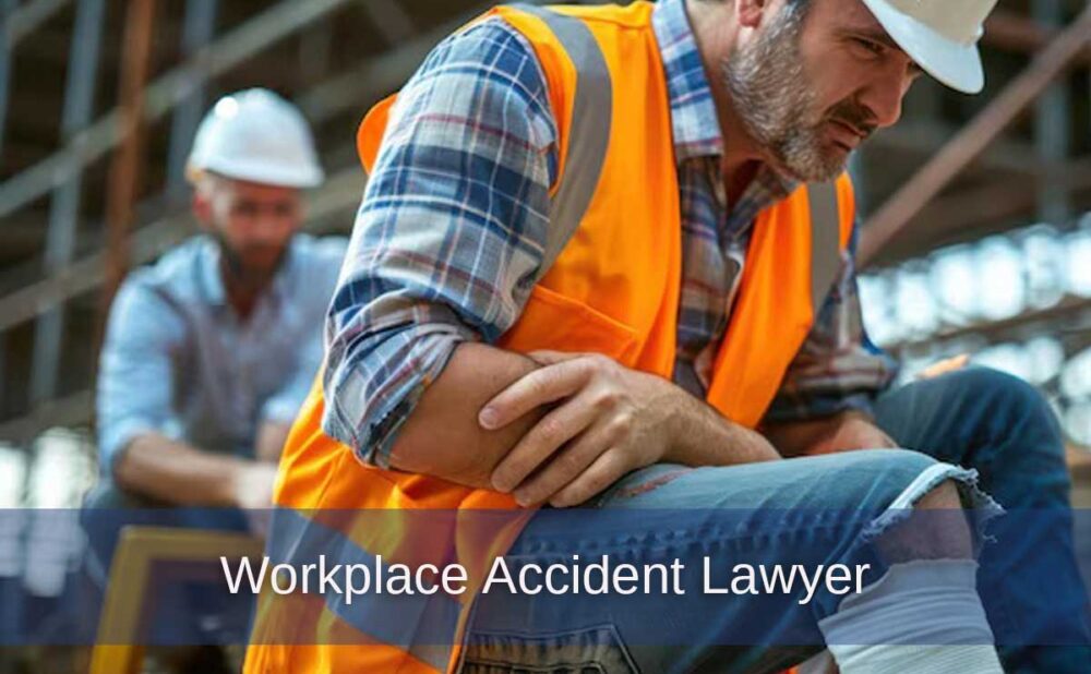 A man in an orange vest sits on a bench after an injury on the job, highlighting the need for a Georgia workplace accident lawyer.