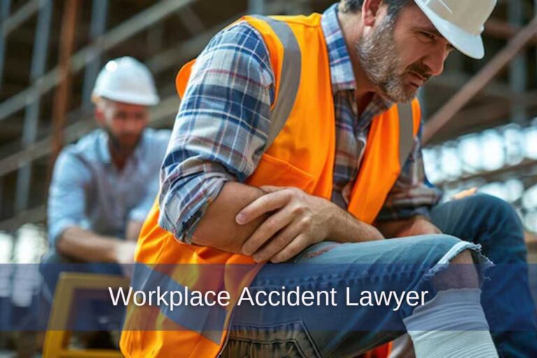 A man in an orange vest sits on a bench after an injury on the job, highlighting the need for a Georgia workplace accident lawyer.