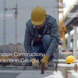 A construction worker wearing a hard hat, illustrating common construction accidents in Georgia.