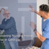 An elderly man holding a cane threatens a care giver, highlighting nursing home abuse in Georgia.
