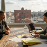 Accident victim consulting lawyer in real office