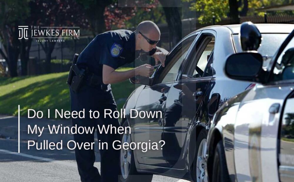 Police officer speaking to a driver through a car window during a traffic stop in Georgia.