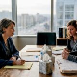 Attorney meeting grieving clients in law office