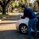 Man photographing car accident scene in Georgia street
