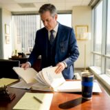 Attorney organizing legal documents on train claims