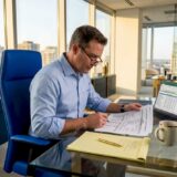 Claims adjuster reviewing trucking accident report