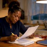 Woman reviewing wrongful death claim documents