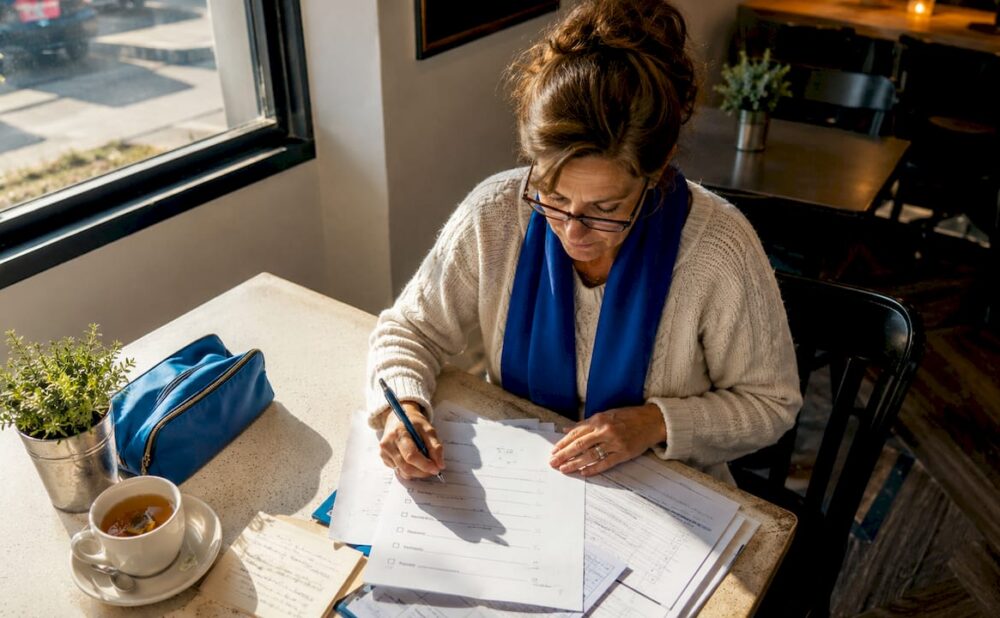 Woman organizing personal injury checklist documents