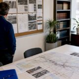 Man reviewing printed fatal accident reports