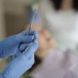 Georgia medical malpractice attorney reviewing dental records while helping a client report dental malpractice.