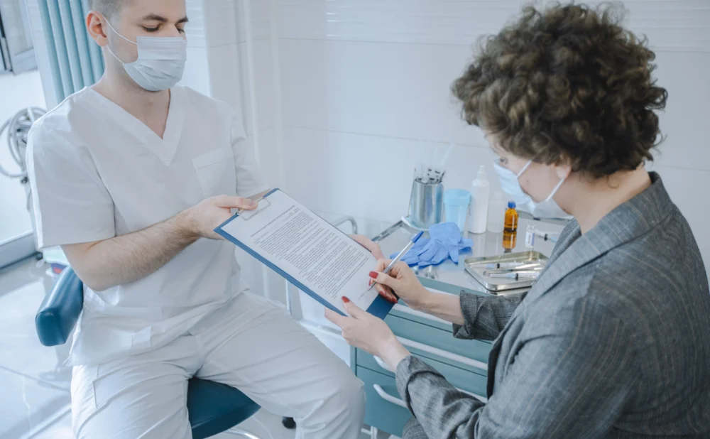 Patient reviewing medical records with a Georgia medical malpractice attorney after suspected medical negligence.