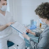 Patient reviewing medical records with a Georgia medical malpractice attorney after suspected medical negligence.
