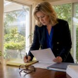 Attorney reviewing statute documents at desk