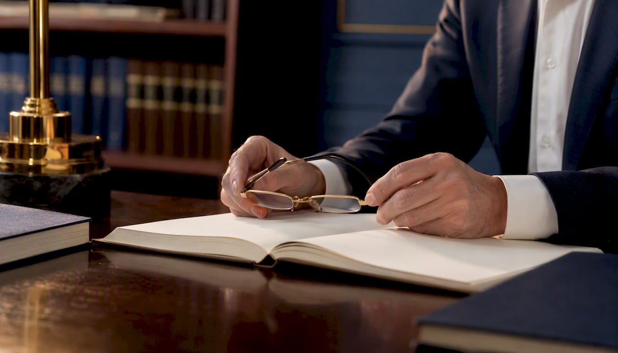 Legal settlement financial documents on desk