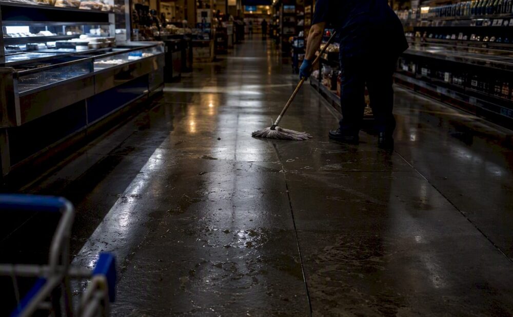 Wet grocery store floor with no warning sign