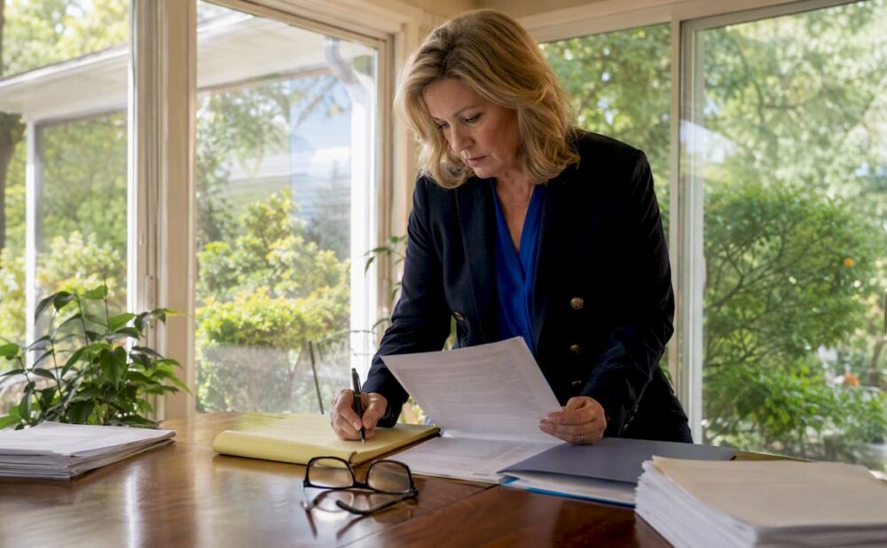 Attorney reviewing statute documents at desk