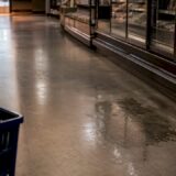 Retail aisle with visible floor hazard