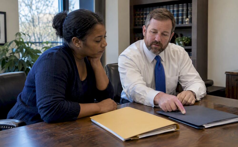 Client and attorney comparing legal options