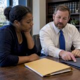 Client and attorney comparing legal options
